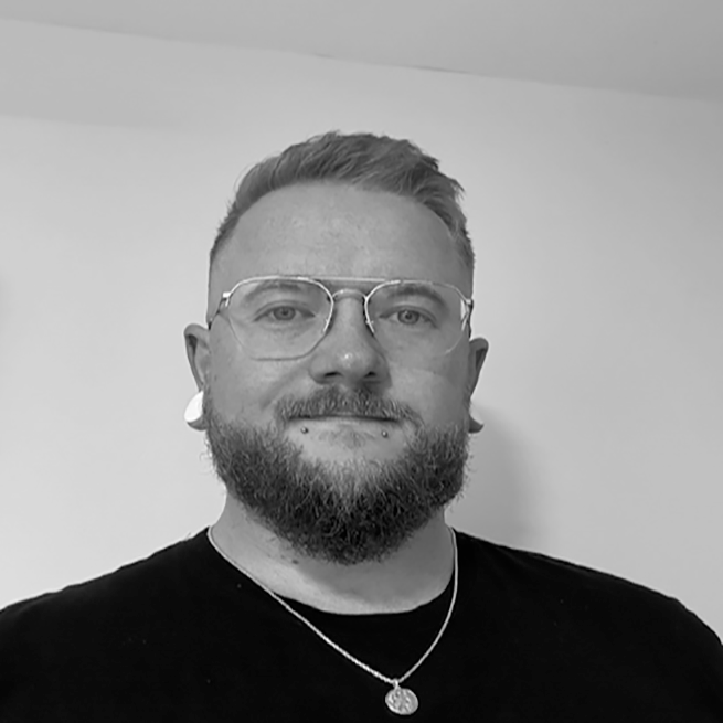 Black and white image of Kyle Kemp, from Nurse to Registered Manager