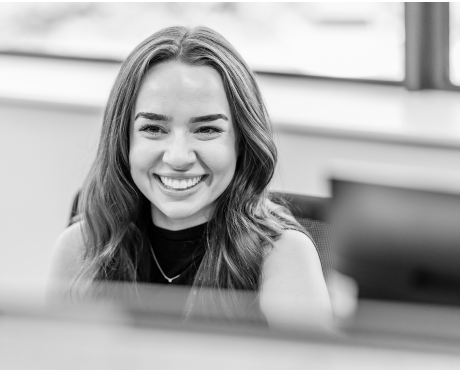 Girl laughing at desk